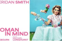 Sheridan Smith in Woman in Mind sitting at a table with a cup of trea and pink roses, dressed in a 1950's fashion style