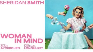 Sheridan Smith in Woman in Mind sitting at a table with a cup of trea and pink roses, dressed in a 1950's fashion style