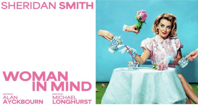 Woman in Mind Sheridan Smith in Woman in Mind sitting at a table with a cup of trea and pink roses, dressed in a 1950's fashion style